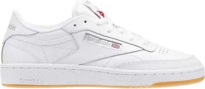 A side view of a white Reebok Club C 85 sneaker with a gum sole.