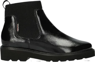 A studio shot of a black chelsea boot.