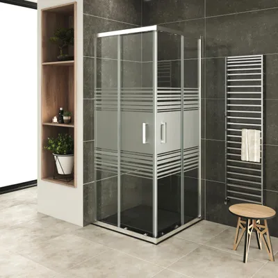 A modern bathroom with a shower cabin, shelves, and a towel rack.