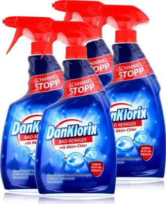 A group of four bottles of cleaning product arranged in a cluster.
