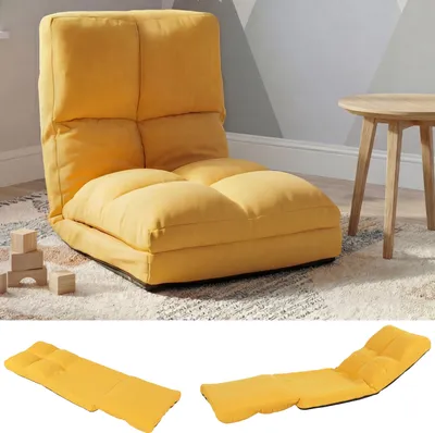 A yellow floor chair is shown in a room with a wooden table and blocks.