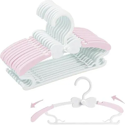 Image de Crochets pour vêtements pour enfants - Lot de 20 pièces, de 28 à 37 cm, en plastique, empilables, avec un manche en forme de papillon, antidérapants, extensibles, de couleur rose et blanche.