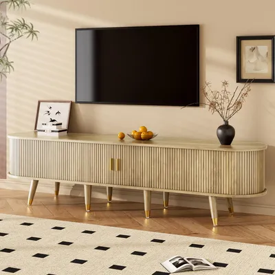 A TV stand with a TV mounted above it, in a living room setting.