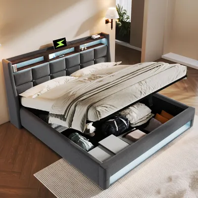 A modern bed with storage, featuring a headboard with built-in lighting and a charging station.