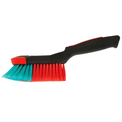A cleaning brush with a black handle and red and teal bristles, isolated on a white background.