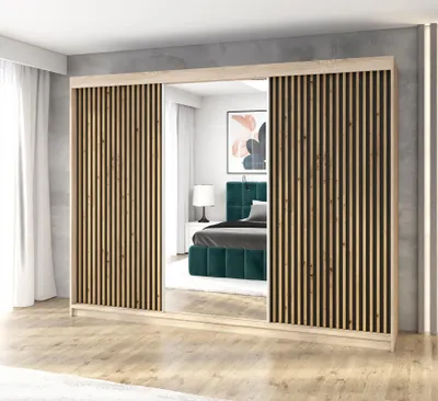 A modern wardrobe with mirrored doors and slatted wood accents, reflecting a bedroom interior.