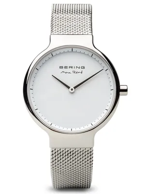 A close-up studio shot of a Bering Max René women's watch with a silver mesh band and a white dial.