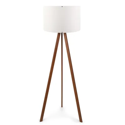 A floor lamp with a white shade and a wooden tripod base is shown against a white background.