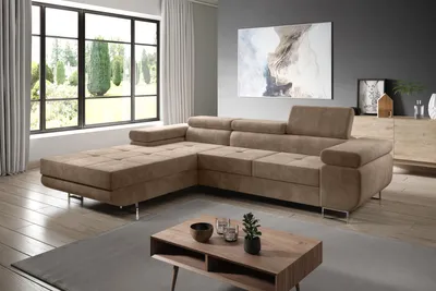 A modern living room with a sectional sofa, coffee table, and large window.