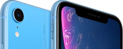 Close-up view of two blue iPhones, one showing the back camera and the other showing the front screen.