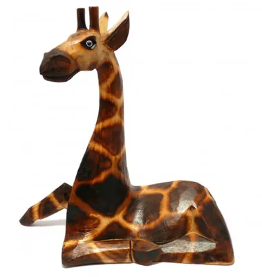 A wooden carved giraffe figurine sitting down, shown from a side-diagonal angle against a white background.