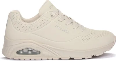 A side view of a single beige SKECHERS UNO sneaker.