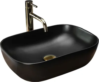 A black oval basin sink with a gold faucet.