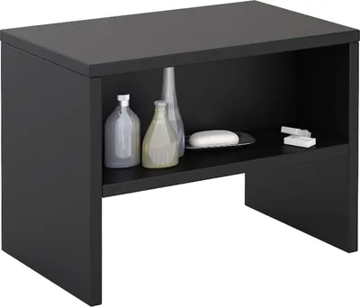 A black nightstand with an open shelf displaying bathroom accessories.