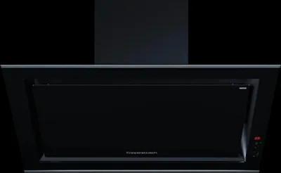 A black range hood against a black background.