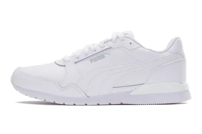 A side view of a white Puma sneaker against a white background.