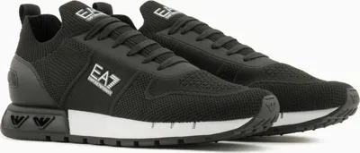 A pair of black Emporio Armani EA7 sneakers.