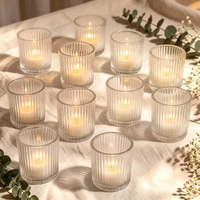 Zdjęcie produktu dla Podstawki na świeczki typu tealight, szklane, 10 sztuk, wymiary 6,5 x 5,5 cm, przeznaczone do świec