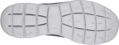 The sole of a gray and white sneaker is shown from an underneath view.