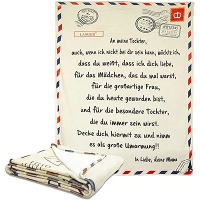 A folded blanket with a letter design is shown next to an unfolded blanket with the same design.
