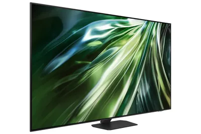 A side view of a modern flat-screen television with a colorful abstract image displayed on its screen, resting on a black stand.