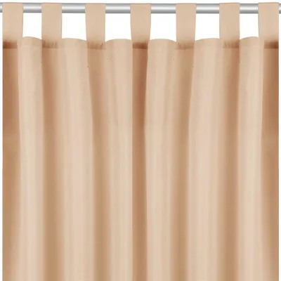 A close-up view of beige curtains hanging from a rod.