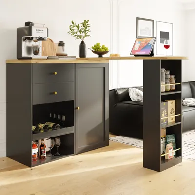 A modern kitchen island with a coffee maker, wine bottles, and a tablet on top, set in a living room.