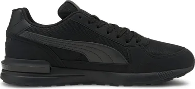 A black Puma sneaker shown from the side against a white background.