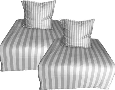 Two beds with striped bedding and pillows, presented against a white background.