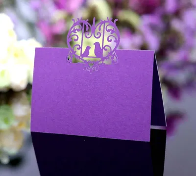 Produktbild von Hochzeitsplatzkarten 100 Stück - Perlmuttpapier - Lasergeschnittenes Namensschild - Tischdekoration - Nachhaltig - 12 x 9 cm - Platzkarten