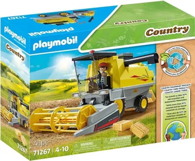 A Playmobil Country combine harvester toy set on its packaging, with a depiction of a farm field and sun.