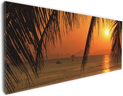 Produktbild von Wallario Premium Leinwandbild Sonnenuntergang unter Palmenblättern in Größe 30 x 75 cm