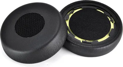 Two black ear pads for headphones are shown against a white background. One ear pad is shown from the top, and the other is shown from the side, revealing its internal structure.
