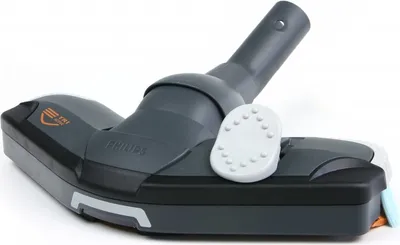 A close-up studio shot of a vacuum cleaner floor head.