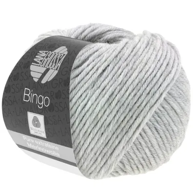A ball of light gray yarn with a label.