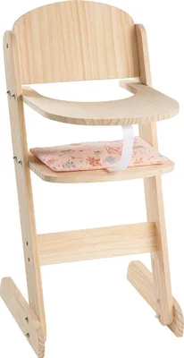 A wooden doll high chair with a patterned cushion.