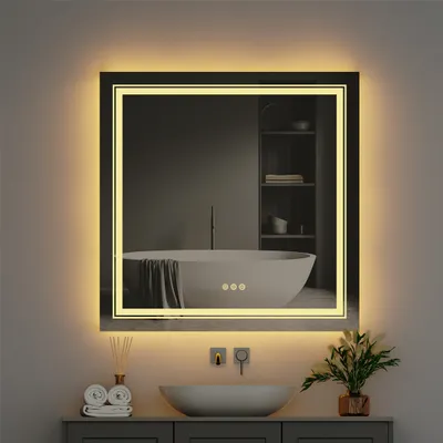 A modern bathroom scene featuring a lit mirror above a sink.