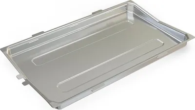 A metal drip tray for a grill.