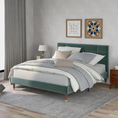 A bedroom scene with a bed, nightstand, and curtains.