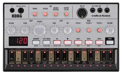 A top-down studio shot of a Korg Volca Bass synthesizer.