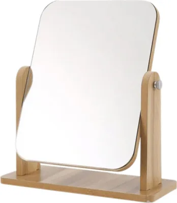 A tabletop mirror with a wooden frame and base.