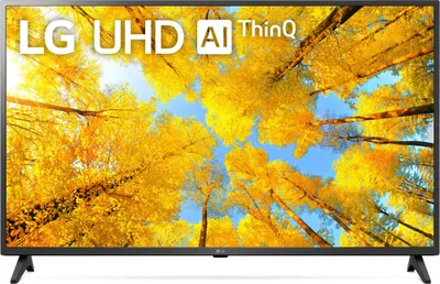 A television screen displaying a vibrant image of trees with yellow leaves against a blue sky.