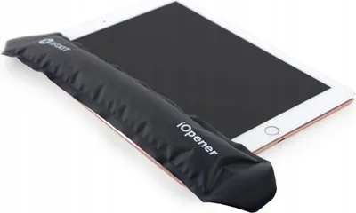 A tablet with a black iOpener tool resting on its screen.