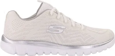 A side view of a white and silver Skechers sneaker.
