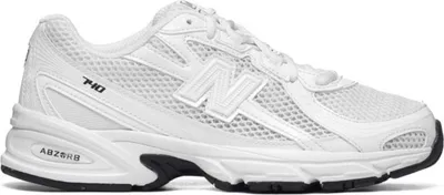 A white New Balance 740 sneaker shown from the side.