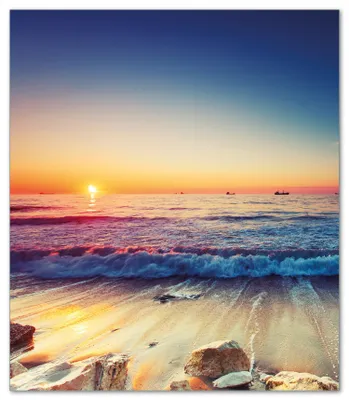 Produktbild von Wallario Herdabdeckplatte aus Glas, Größe 52 x 60 cm 1-teilig, Motiv Sonnenuntergang am Meer mit Wellen am Strand