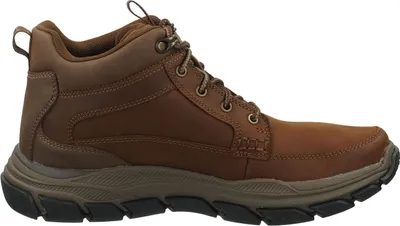 A side view of a brown leather boot.
