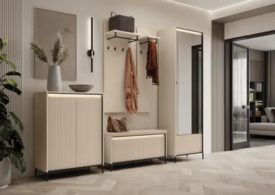 A modern entryway with a beige and black wardrobe set, featuring a mirror and LED lighting.