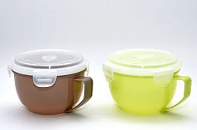 Two plastic bowls with lids and handles are shown against a white background.