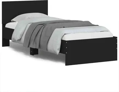A black bed frame with a headboard, mattress, and bedding, shown against a white background.